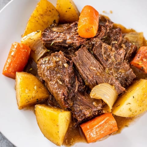 Hearty Beef Pot Roast, a classic comfort meal, featuring slow-cooked beef and fresh vegetables.