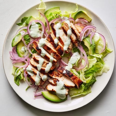 Grilled Smoky Chipotle Chicken Wrap served warm with tangy Greek yogurt sauce and diced tomatoes.