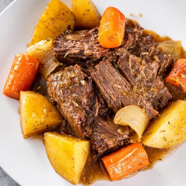 Hearty Beef Pot Roast, a classic comfort meal, featuring slow-cooked beef and fresh vegetables.